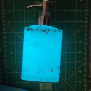 Glow in the dark soap dispenser